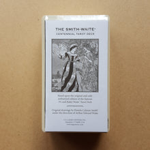 Load image into Gallery viewer, The white paper guidebook of the Smith-Waite Centennial Edition tarot deck.  Detail shows the deck is shrink wrapped.