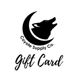 Coyote Supply Co logo of a crescent moon cradling a howling coyote head and the words "gift card" in script below in black on a white background.