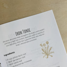 Load image into Gallery viewer, Inner page detail of “Simple Home Herbal Recipes” by Safiyyah Bazemore of Nour Herbals.  White paper page features a recipe for an iron tonic in black text with a mustard yellow illustration of a dandelion.  Available at Coyote Supply Co a zero waste witch store located in Midtown Reno, Nevada that is BIPOC owned.