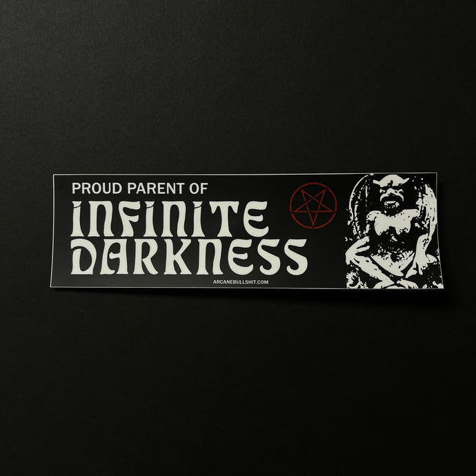 A black bumper sticker with white text that says Proud Parent of Infinite Darkness and arcanebullshit.com. The design also features a red pentagram and white gargoyle demon looking statue.  Sold at Coyote Supply Co a BIPOC and LGBTQIA+ owned zero waste witch store in Reno Nevada 