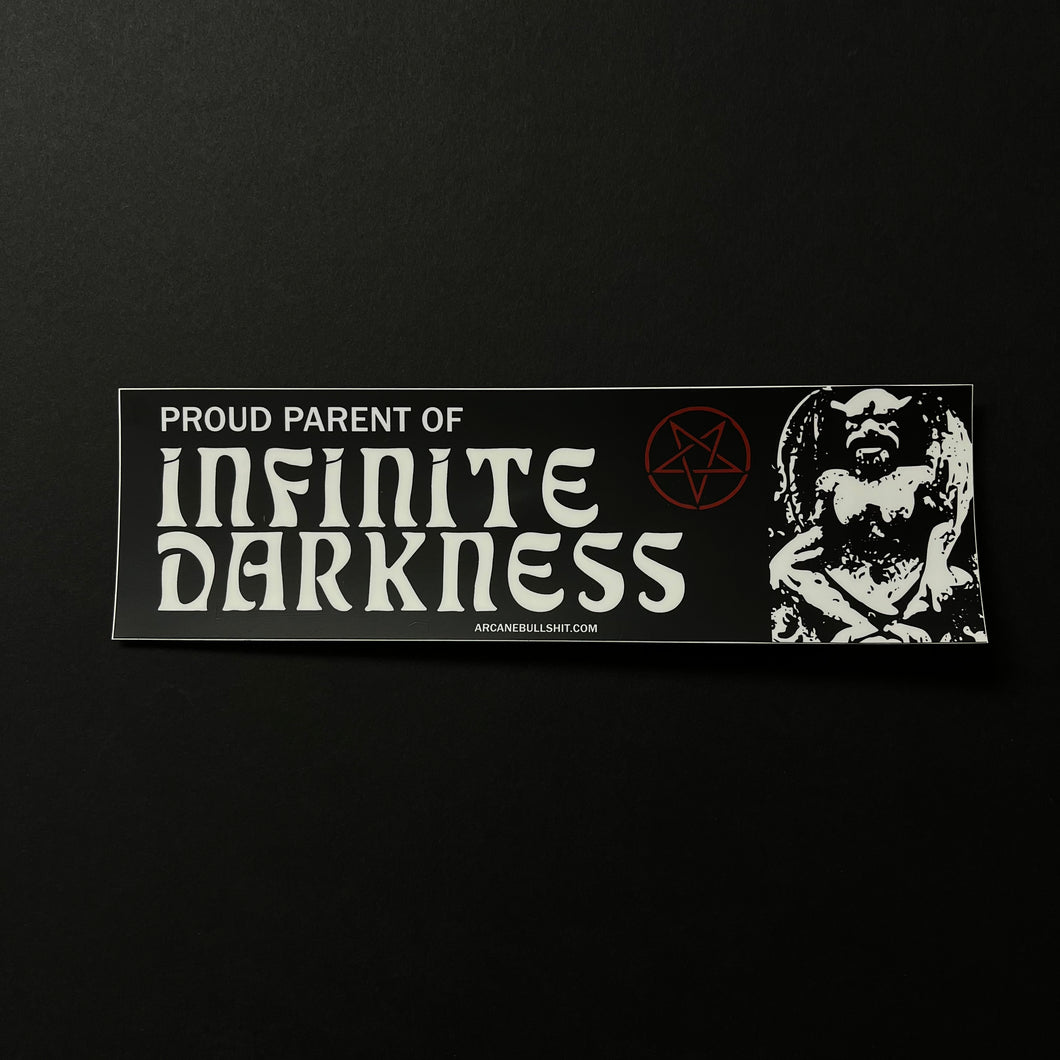 A black bumper sticker with white text that says Proud Parent of Infinite Darkness and arcanebullshit.com. The design also features a red pentagram and white gargoyle demon looking statue.  Sold at Coyote Supply Co a BIPOC and LGBTQIA+ owned zero waste witch store in Reno Nevada 