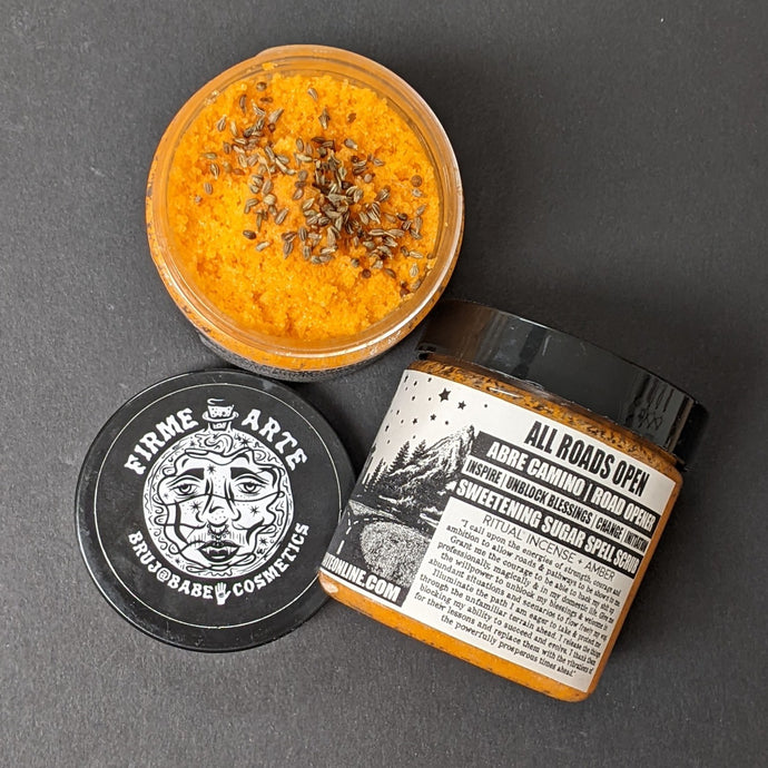Orange sugar scrub in a plastic container with a black and white label that reads Hella Sensitive. Sold at Coyote Supply Co a BIPOC and LGBTQIA+ owned zero waste witch store in Reno Nevada