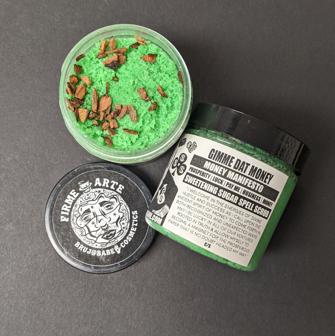 Green sugar scrub in a plastic container with a black and white label that reads Gimme Dat Money. Sold at Coyote Supply Co a BIPOC and LGBTQIA+ owned zero waste witch store in Reno Nevada