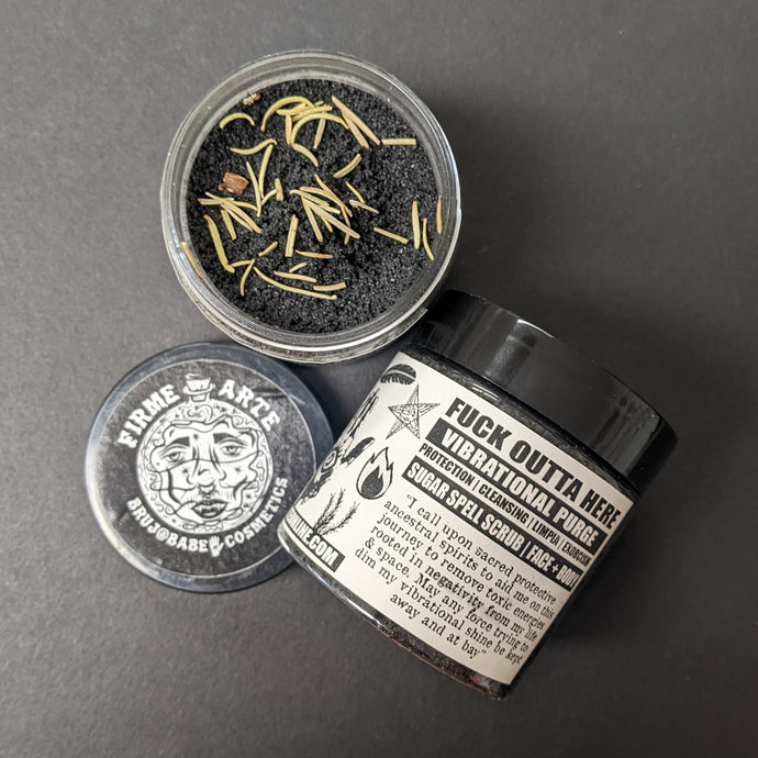 Black sugar scrub in a plastic container with a black and white label that reads Fuck Outta Here. Sold at Coyote Supply Co a BIPOC and LGBTQIA+ owned zero waste witch store in Reno Nevada