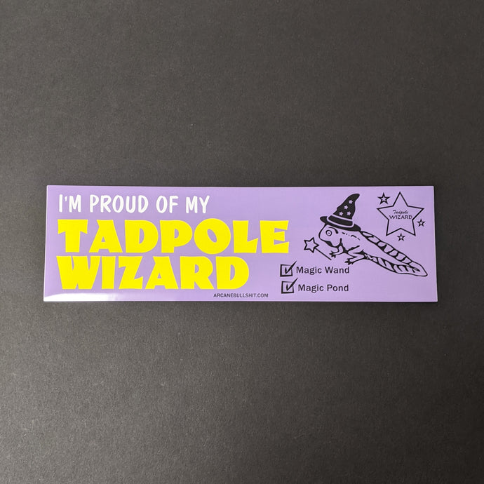 A light purple bumper sticker with a tadpole wizard that reads: I'm proud of my tadpole wizard.  Sold at Coyote Supply Co a BIPOC and LGBTQIA+ owned zero waste witch store in Reno Nevada 
