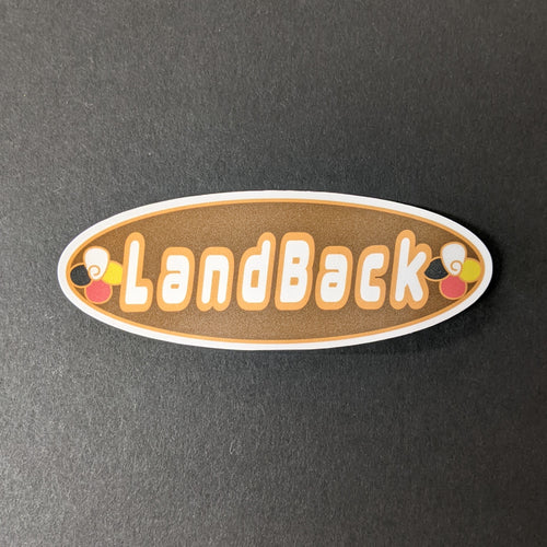 A brown oval vinyl sticker that read 