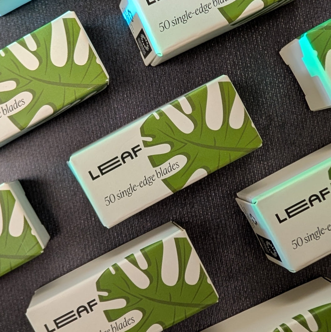 A grid of Leaf Razor branded 50 single edge razor blade packs. The paper packages are white with a monstera leaf illustration.
Sold at Coyote Supply Co a BIPOC and LGBTQIA+ owned zero waste witch store in Reno Nevada