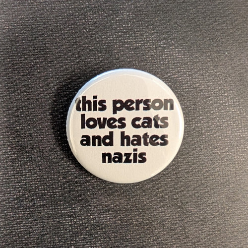 White button with black text that reads 