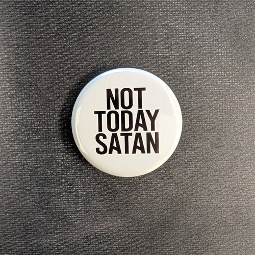 A white button with black sans serif text that reads 