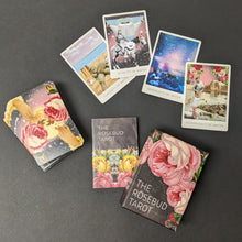 Load image into Gallery viewer, A tarot deck and guide that reads The Rosebud Tarot featuring illustrations of roses. There is a spread of cards that show the collage style art used in the deck. Sold at Coyote Supply Co a BIPOC and LGBTQIA+ owned zero waste witch store in Reno Nevada 