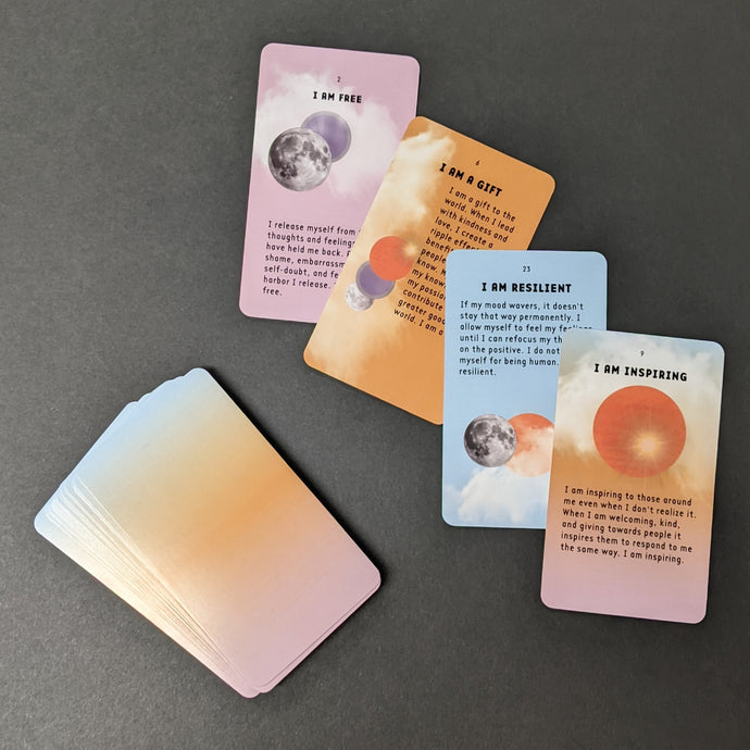 An assortment of cards from the I Am Everything deck that read I am Free, I am a gift, I am Resilient, and I am Inspiring. Sold at Coyote Supply Co a BIPOC and LGBTQIA+ owned zero waste witch store in Reno Nevada