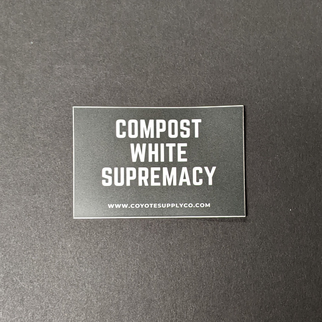 A black rectangular matte sticker that reads: Compost White Supremacy in bold white text. Sold at Coyote Supply Co a BIPOC and LGBTQIA+ owned zero waste witch store in Reno Nevada