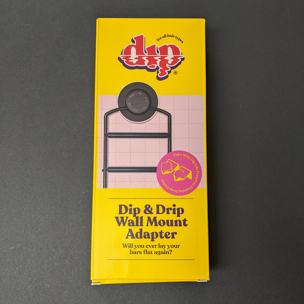 The Dip wall mount adapter box featuring a photo of the metal rack with a suction cup meant to hold Dip soap savers. Sold at Coyote Supply Co a BIPOC and LGBTQIA+ owned zero waste witch store in Reno Nevada