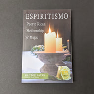 A book witch a cover featuring a photo of candles and flowers that reads Espiritismo by Hector Salva. Sold at Coyote Supply Co a BIPOC and LGBTQIA+ owned zero waste witch store in Reno Nevada 