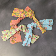 Three upcycled sari textile cloths of varying colorful patterns on a dark background.
Sold at Coyote Supply Co a BIPOC and LGBTQIA+ owned zero waste witch store in Reno Nevada