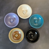 Five round incense stick burners of assorted colors on a dark background. The colors starting at the top going clockwise are ivory, teal, black, light green with brown speckles, and purple.

This item is sold at Coyote Supply Co a BIPOC and LGBTQIA+ owned zero waste witch store in Reno Nevada