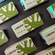 A grid of Leaf Razor branded 50 single edge razor blade packs. The paper packages are white with a monstera leaf illustration.
Sold at Coyote Supply Co a BIPOC and LGBTQIA+ owned zero waste witch store in Reno Nevada