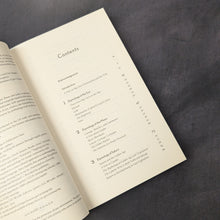 Load image into Gallery viewer, Post Colonial Astrology book table of contents pictured on a dark background.

This item is sold at Coyote Supply Co a BIPOC and LGBTQIA+ owned zero waste witch store in Reno Nevada