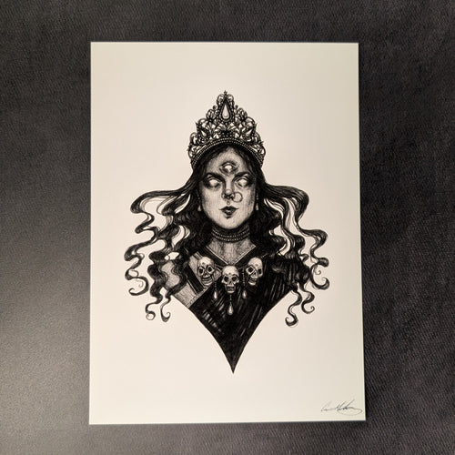 Black drawing on white paper of Kali from the chest up. She has a crown, three skulls on her sari and long flowing wavy hair.Sold at Coyote Supply Co a BIPOC and LGBTQIA+ owned zero waste witch store in Reno Nevada