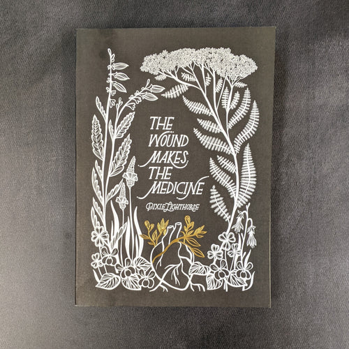 A black paperback book cover with white illustrations of plants and one gold plant on a heart, the cover has white thin text that reads 