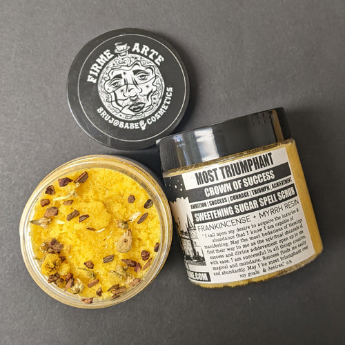 Yellow sugar scrub in a plastic container with a black and white label that reads Most Triumphant. Sold at Coyote Supply Co a BIPOC and LGBTQIA+ owned zero waste witch store in Reno Nevada