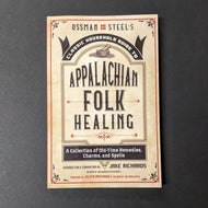 A beige book cover that reads Ossman and  Steel's Classic Household Guide to Appalachian Folk Healing A Collection of Old-Time Remedies, Charms, and Spells Introduction & Commentary by Jake Richards. Sold at Coyote Supply Co a BIPOC and LGBTQIA+ owned zero waste witch store in Reno Nevada