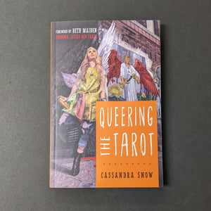 An illustrated book cover depicting a woman holding a spray paint cand next to a mural of the tarot card Temperance by Cassandra Snow. Reads Queering the Tarot in thin white letters. Available at Coyote Supply Co, a zero waste witch store in Midtown Reno, Nevada that is BIPOC owned