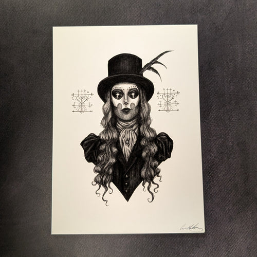 A black drawing on white paper of Maman Brigitte from the chest up. She is wearing a top hat with feathers on the  right side and a puffy shoulder coat. Her hair is long and wavy. On either side of her are her Veve that represnt her. Sold at Coyote Supply Co a BIPOC and LGBTQIA+ owned zero waste witch store in Reno Nevada