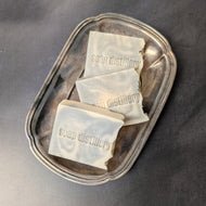 Three white and grey soap bars in a silver plate on a black background. The soap bars are stamped with the brand name Soap Distillery.

This item is sold at Coyote Supply Co a BIPOC and LGBTQIA+ owned zero waste witch store in Reno Nevada