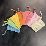 An assortment of colorful soap saver bags pictured on a dark background.

This item is sold at Coyote Supply Co a BIPOC and LGBTQIA+ owned zero waste witch store in Reno Nevada