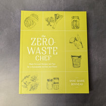 Load image into Gallery viewer, A yellow paperback book on a dark background. The cover reads:
the
Zero Waste Chef 
Plant-Forward Recipes and Tips for a Sustainable Kitchen and Planet
Anne-Marie
Bonneau

This item is sold at Coyote Supply Co a BIPOC and LGBTQIA+ owned zero waste witch store in Reno Nevada