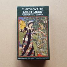 Load image into Gallery viewer, Front cover of Smith-Waite Centennial Edition tarot deck&#39;s box.  Box is bordered with dark green, text is in white, and artwork features two people in ornate flowing gowns talking, with a third person in a gown in the upper left background available at Coyote Supply Co, a zero waste witch store in Midtown Reno, Nevada that is BIPOC owned