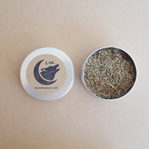 Left: round aluminium tin lid with round kraft label that has been hand stamped with the Coyote Supply Co. logo of a crescent moon cradling a howling coyote head.  Right: round aluminium tin full of ground herbs and spices available at Coyote Supply Co, a zero waste witch store in Midtown Reno, Nevada that is BIPOC owned