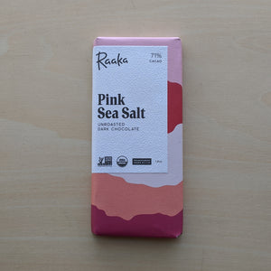 Paper wrapped Pink Sea Salt chocolate bar  by Raaka available at Coyote Supply Co, a zero waste witch store in Midtown Reno, Nevada that is BIPOC owned