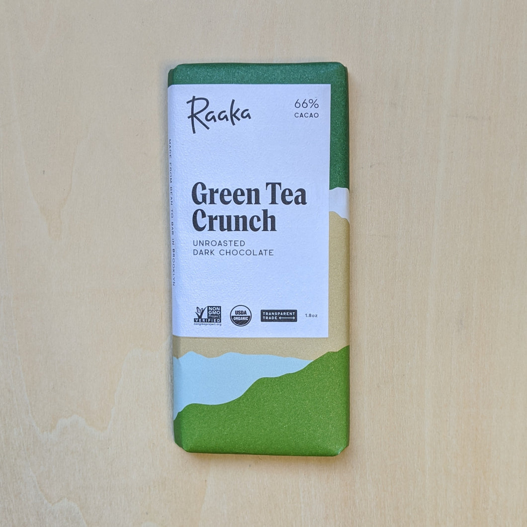Green & white paper wrapped chocolate bar  by Raaka available at Coyote Supply Co, a zero waste witch store in Midtown Reno, Nevada that is BIPOC owned