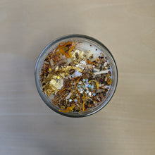 Load image into Gallery viewer, White soy wax candle topped with confetti, herbs including marigolds, and gold leaf by Firme Arte available at Coyote Supply Co, a zero waste witch store in Midtown Reno, Nevada that is BIPOC owned