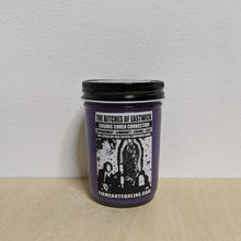Load image into Gallery viewer, Purple soy wax candle in glass jar with black lid.  Features white label with black artwork of the characters from The Craft &amp; The Virgin of Guadalupe available at Coyote Supply Co, a zero waste witch store in Midtown Reno, Nevada that is BIPOC owned