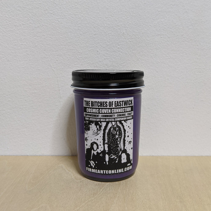 Purple soy wax candle in glass jar with black lid.  Features white label with black artwork of the characters from The Craft & The Virgin of Guadalupe available at Coyote Supply Co, a zero waste witch store in Midtown Reno, Nevada that is BIPOC owned