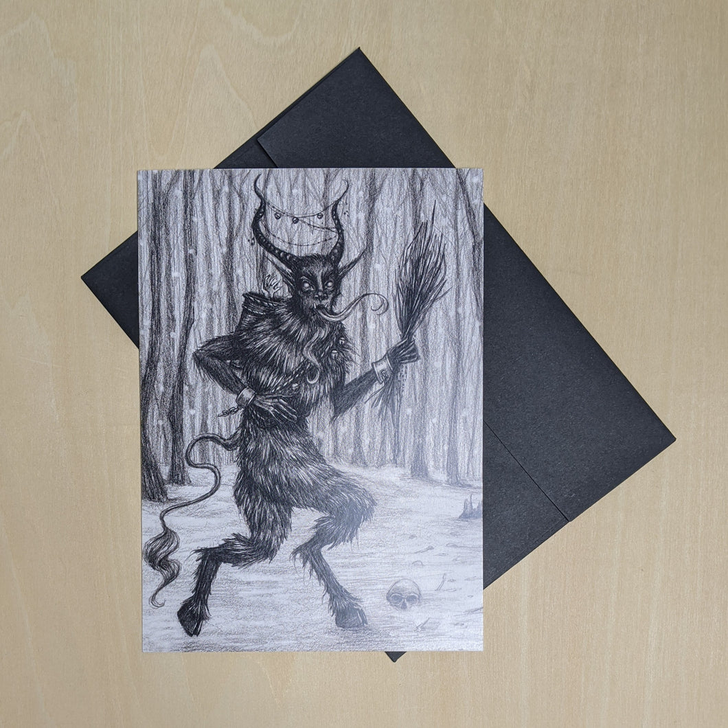 Black ink Krampus illustration on white paper with black envelope available at Coyote Supply Co, a zero waste witch store in Midtown Reno, Nevada that is BIPOC owned