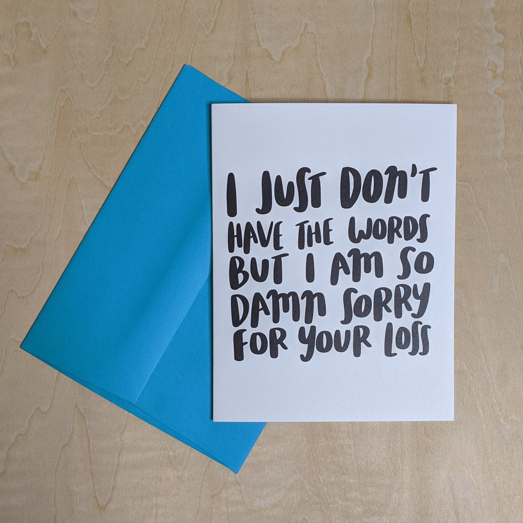 Teal envelope layered under a white paper card with black text that reads 