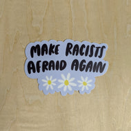 Baby blue sticker with black text reads 