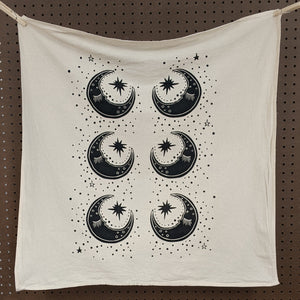 Zero waste universal cloth.  Unbleached cotton with black sleepy crescent moons and a sprinkling of stars.  Witch made by The Rainbow Vision available at Coyote Supply Co, a zero waste witch store in Midtown Reno, Nevada that is BIPOC owned