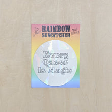 Load image into Gallery viewer, Suncatcher sticker by Hills + Holler. Round sticker appears pearlescent white and reads &quot;every queer is magic&quot; in handwritten block letters. Sticker is on a rainbow background. available at Coyote Supply Co, a zero waste witch store in Midtown Reno, Nevada that is BIPOC owned