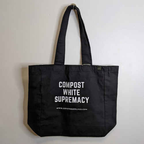 Black tote bag reads 