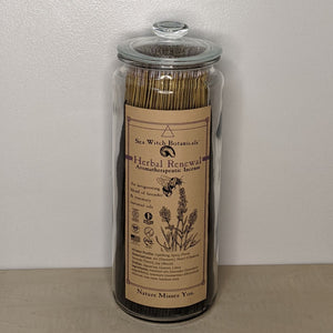 Glass jar filled with Herbal Renewal incense by Sea Witch Botanicals. Kraft paper label features a black illustration of a bee and lavender available at Coyote Supply Co, a zero waste witch store in Midtown Reno, Nevada that is BIPOC owned
