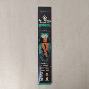 Black paper envelope containing incense by Sea Witch Botanicals. Envelope features a teal & orange illustration of 4 people swimming in a lake by a bonfire available at Coyote Supply Co, a zero waste witch store in Midtown Reno, Nevada that is BIPOC owned