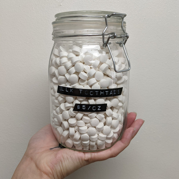 A large jar of Huppy Watermelon Strawberry tooth tabs toothpaste. Sold at Coyote Supply Co a BIPOC and LGBTQIA+ owned zero waste witch store in Reno Nevada 