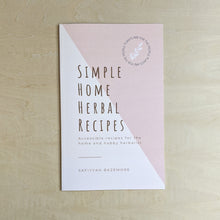 Load image into Gallery viewer, Light pink paper zine, title in brown reads &quot;Simple Home Herbal Recipes&quot; with text underneath that reads &quot;Accessible recipes for the home and hobby herbalist by Saffiyah Bazemore&quot; available at Coyote Supply Co, a zero waste witch store in Midtown Reno, Nevada that is BIPOC owned.