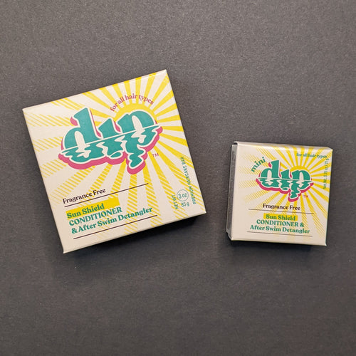 Dip Fragrance Free Conditioner in a beige box with a sun in regular 4oz and .75oz travel sizes. Sold at Coyote Supply Co a BIPOC and LGBTQIA+ owned zero waste witch store in Reno Nevada