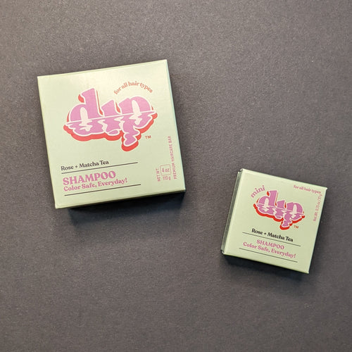 Dip Rose + Matcha Tea Shampoo in a light green box in regular 4oz and .75oz travel sizes. Sold at Coyote Supply Co a BIPOC and LGBTQIA+ owned zero waste witch store in Reno Nevada